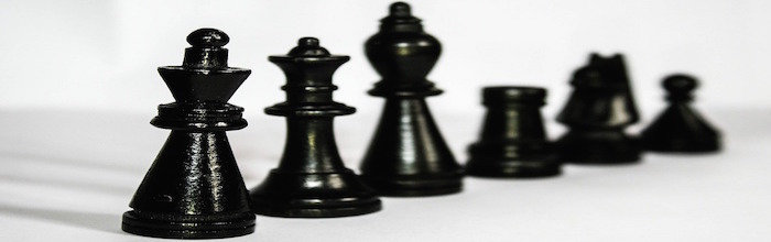 Black chess pieces: king, queen, and others