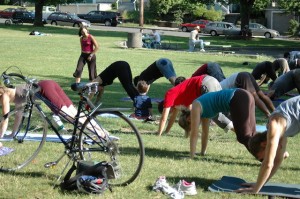 Bikers doing yoga in the park (Flickr by Elly Blue)