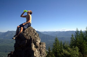 man drinking water on a mountain (Flickr by Papalars)