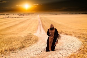 monk, hooded robe, walking, dirt road