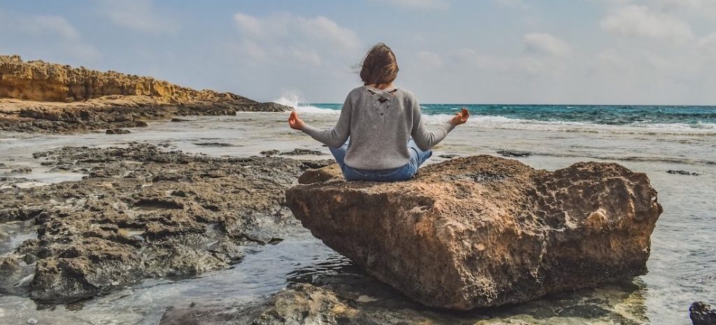 mindful stillness - woman meditating